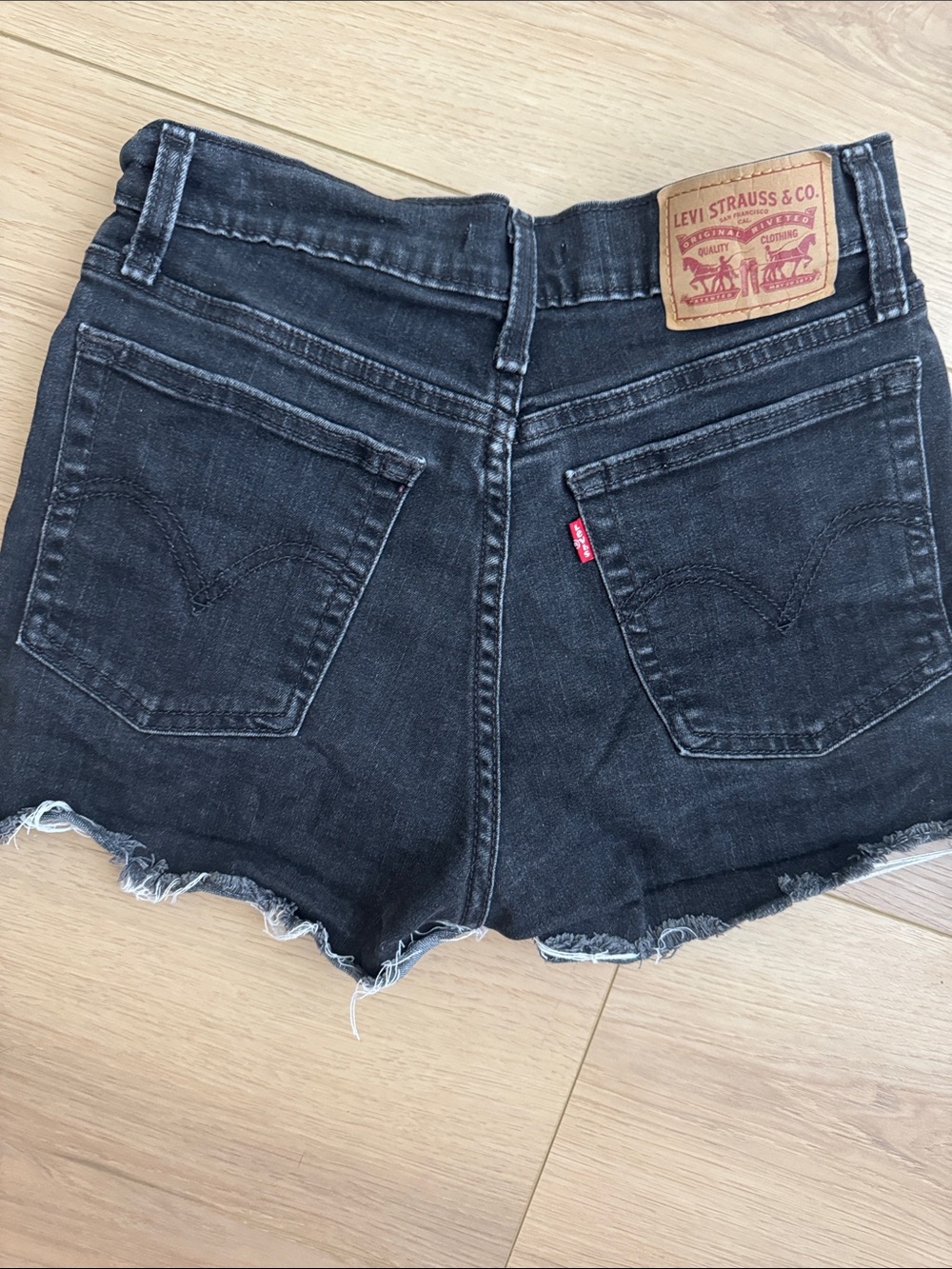 Levi’s black distressed high rise shorts size 27